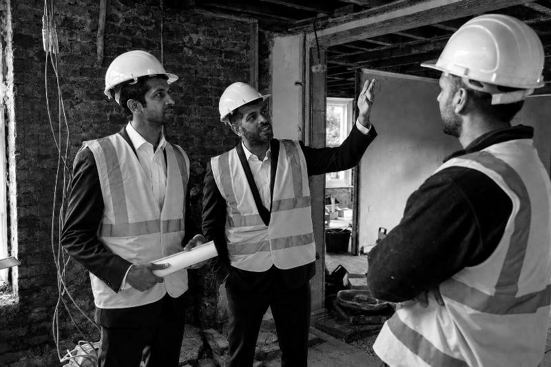 Founders reviewing work during an active refurbishment